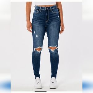 Medium wash ripped ultra high rise super skinny jeans